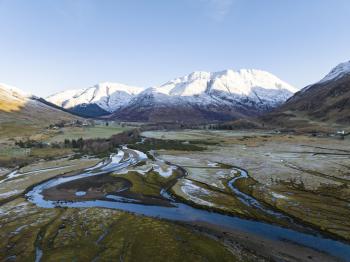 Aerial view Looking East along the RIver Croe towards Beinn Fhada with snow capping the peaks