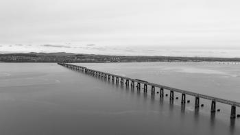 The Tay (railway) Bridge on a grey day. The train from Dundee is Dwarfed by this structure (B&W photo