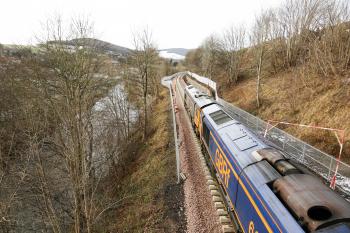 66761 and 66741 wait to push the track laying train towards Tweedbank with this view looking towards Galashiels with Gala Water to the left